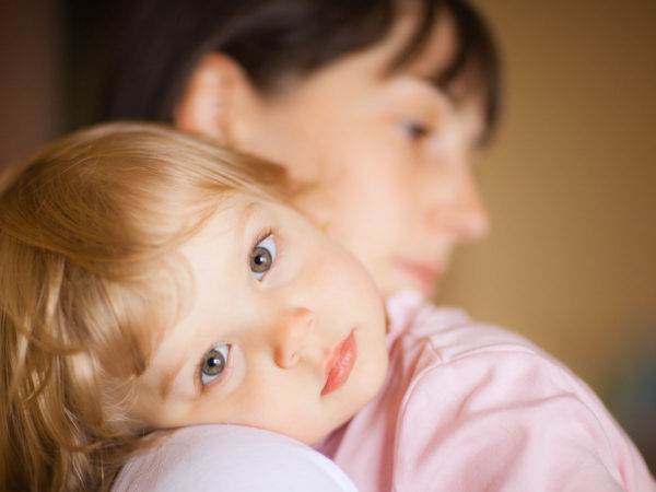 young girl with concerned mother