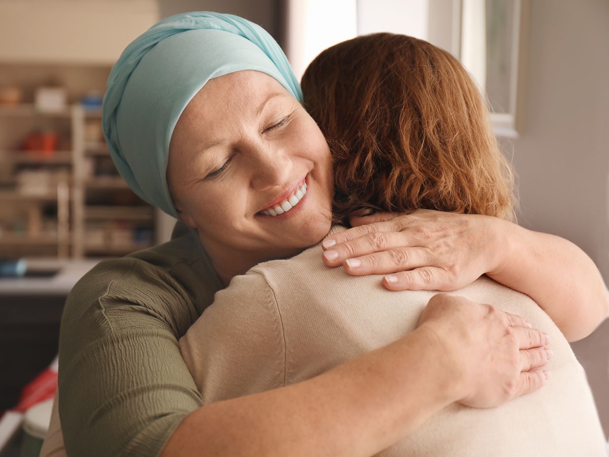 ill woman hugs friend