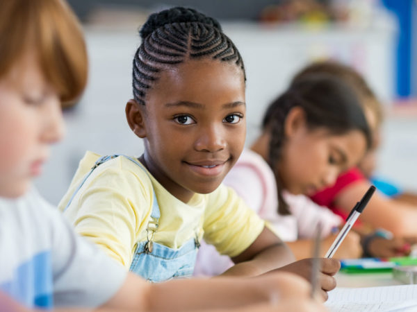 student happy to be in school