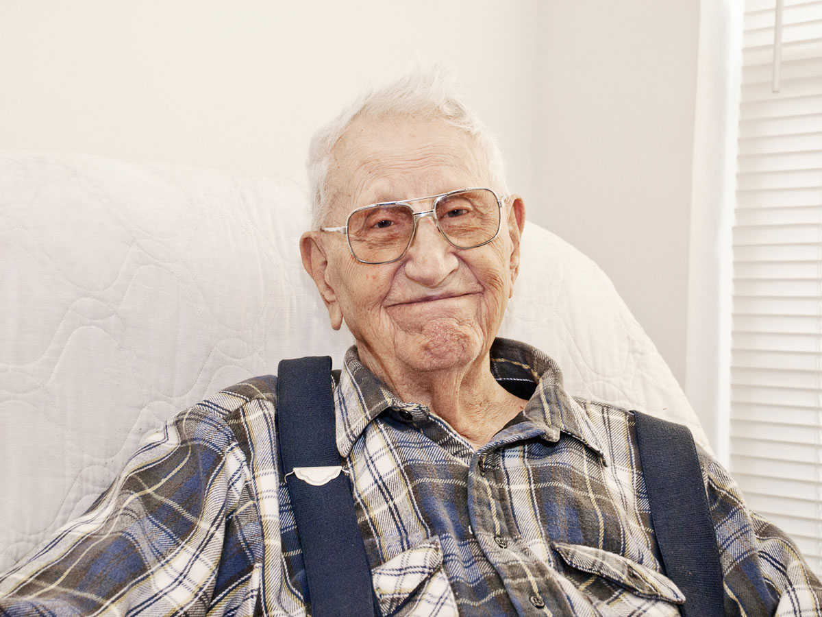 elderly man in suspenders